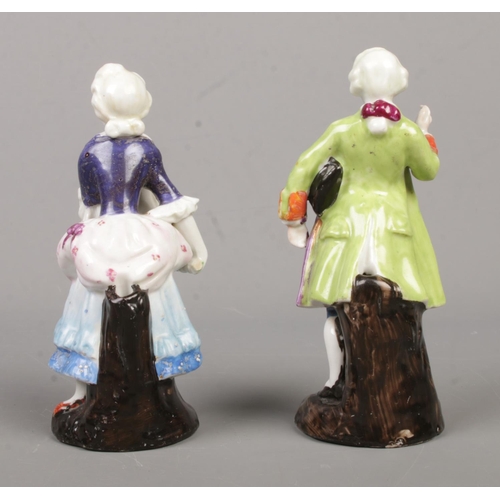 14 - A pair of 19th century continental porcelain figures, lady and a gentleman. Both having impressed ma... 