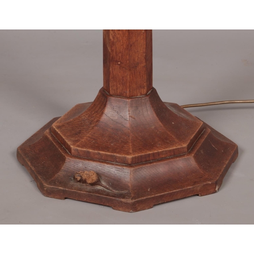 140 - Robert 'Mouseman' Thompson, an oak standard lamp. Having carved mouse signature.