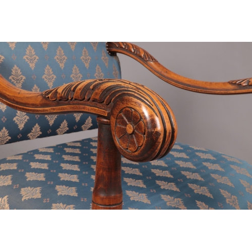 143 - A French style carved walnut throne chair raised on paw feet. Height of back 113cm.