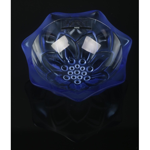 27 - A small Lalique blue glass pin dish with floral decoration. Having original sticker and etched signa... 