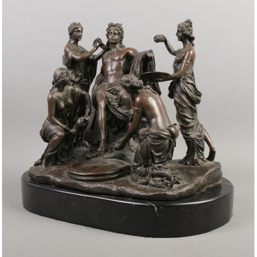 33 - A bronze figure group formed as a Roman being attended by four maidens raised on marble base. Inscri... 