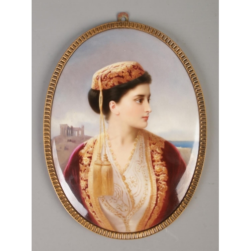 4 - A KPM hand painted porcelain plaque, portrait of a maiden, in gilt metal frame. Impressed marks to b... 