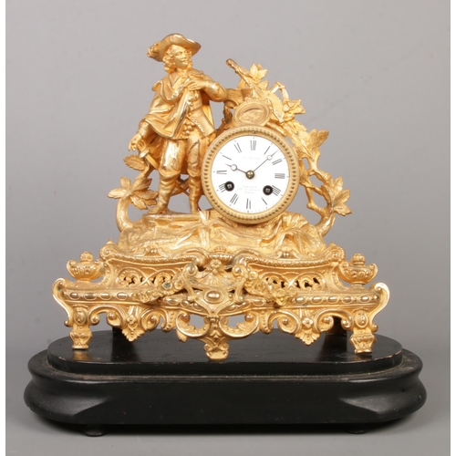 53 - A 19th century French gilt mantel clock under glass dome. The clock surmounted with a cavalier. The ... 