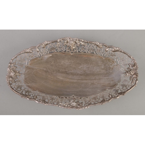 71 - A silver pedestal dish of oval form. Having scrollwork decoration with vine borders. Assayed Sheffie... 