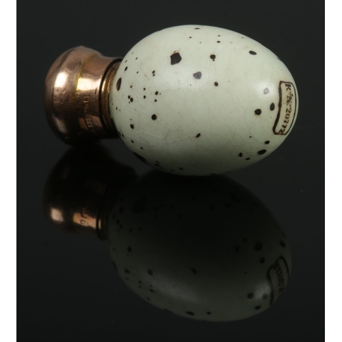 82 - A Victorian miniature porcelain scent bottle modelled as a birds egg with 9ct gold top. Makers marks... 