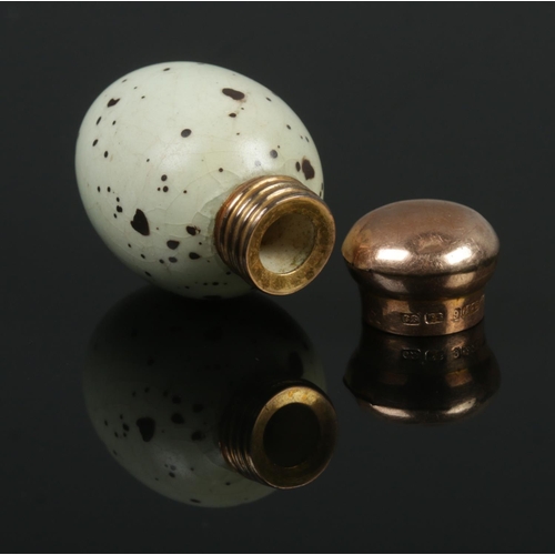 82 - A Victorian miniature porcelain scent bottle modelled as a birds egg with 9ct gold top. Makers marks... 