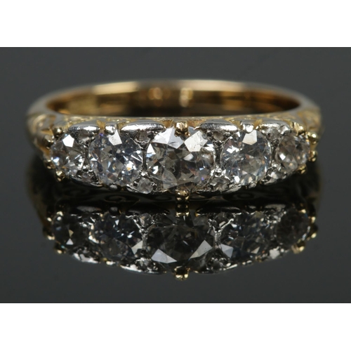 93 - An 18ct gold five stone diamond ring. Central diamond approximately 0.5ct. Size L. 3.69g.