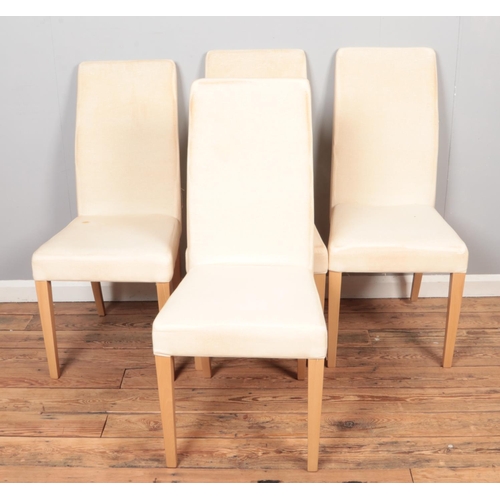 598 - A set of four modern dining chairs.