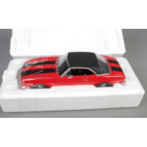 155 - A boxed ERTL American Muscle Authentics 1/18th scale Chevrolet Camaro Z-28. (No. 33272)