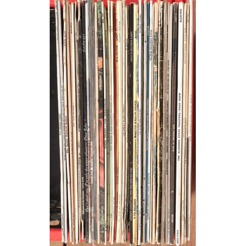 334 - A box of LP records. Includes Beatles, Rolling Stones, U2, Madness, David Essex, etc.