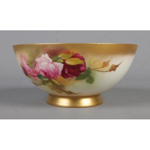 573 - A Royal Worcester blush porcelain bowl painted with rose design, signed Spilsbury. Dated approx. 192... 