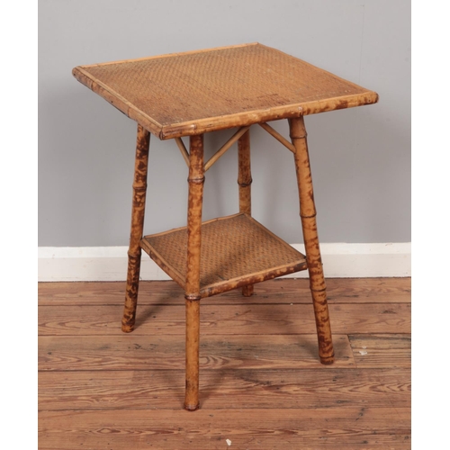 614 - A Victorian Aesthetic movement bamboo table with rattan top.