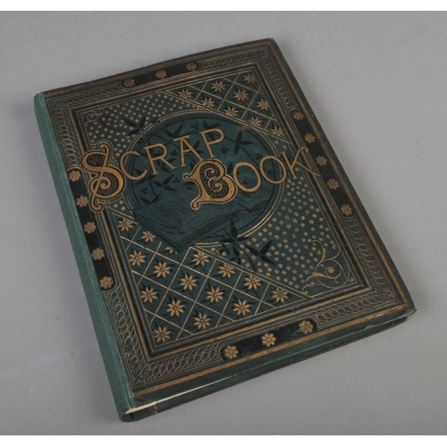 185 - A scrap book album filled with Victorian and late scraps of various themes including horses, childre... 