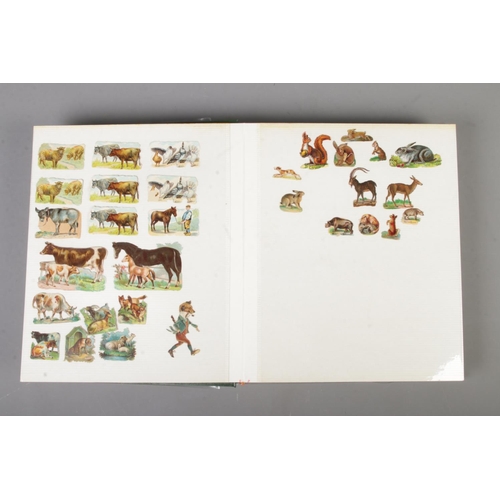 190 - A large album of Victorian and later scraps of various themes including farm animals, musical animal... 