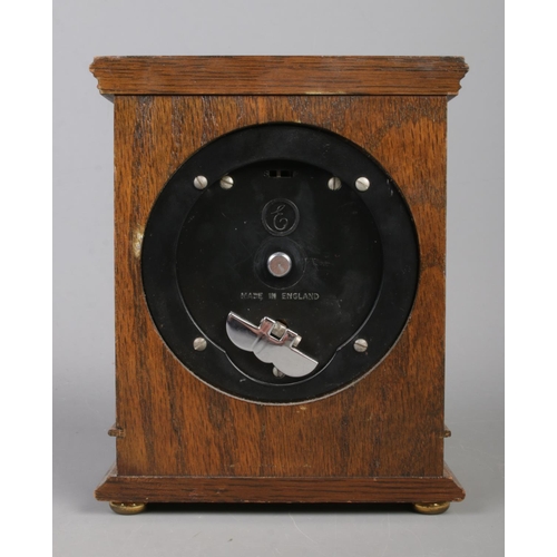 218 - A mahogany cased Elliott mantle clock, with Roman Numeral dial inscribed 'Hamilton & Inches', Edinbu... 