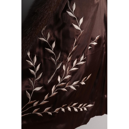 387 - A vintage dark brown mink coat with embroided design to inner fabric.