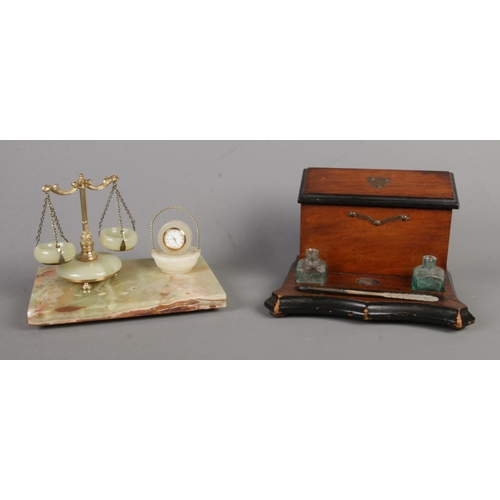 391 - Two desk stands, both with perpetual calendars, including an onyx example, together with an onyx des... 