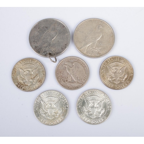 564 - Two American Peace dollars, dated 1922 and 1923, together with five half dollars; 1944 and 1964 x 4.... 