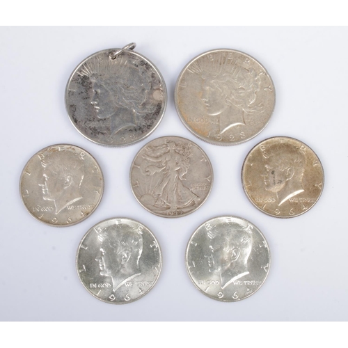 564 - Two American Peace dollars, dated 1922 and 1923, together with five half dollars; 1944 and 1964 x 4.... 