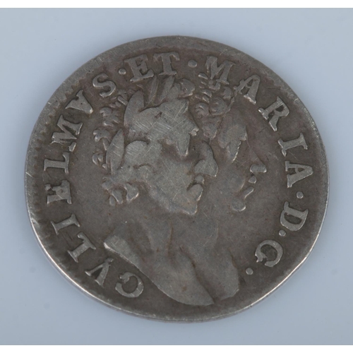 569 - A 1689 William and Mary groat (four pence).