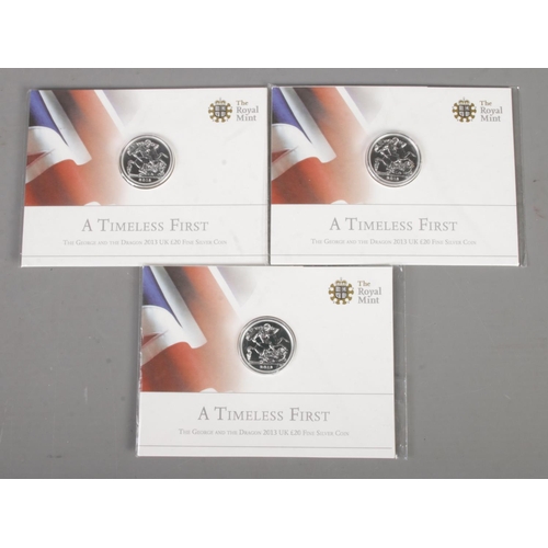 590 - The Royal Mint; Three 0.999 fine silver 2013 'A Timeless First' George and the Dragon £20 coins, in ... 