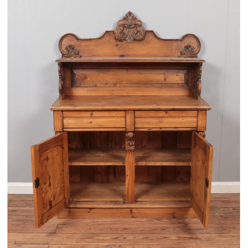 604 - A Victorian pine chiffonier, with cupboard door base and carved scrolled detailing. Height: 145cm, W... 