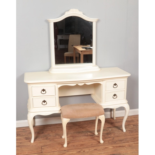 605 - A white painted Willis and Gambier dressing table, mirror and footstool, with labels to the inside d... 