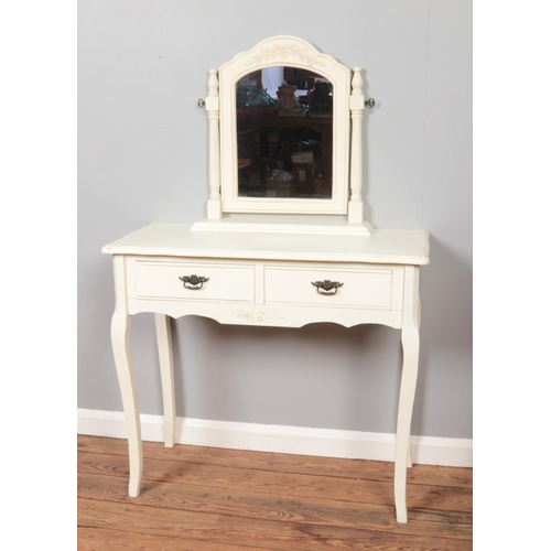 606 - A white painted dressing table with two drawers and mirror. Height: 139cm, Width: 90cm, Depth: 40cm.