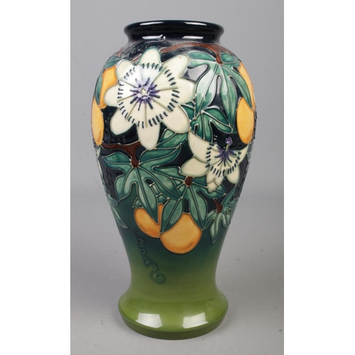 105 - A Moorcroft pottery vase decorated in the Passion Fruits pattern by Rachel Bishop. Date cypher for 1... 