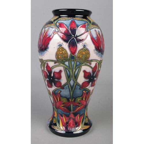 108 - A Moorcroft pottery vase decorated in the Delonix pattern by Shirley Hayes. Date cypher for 2003. He... 