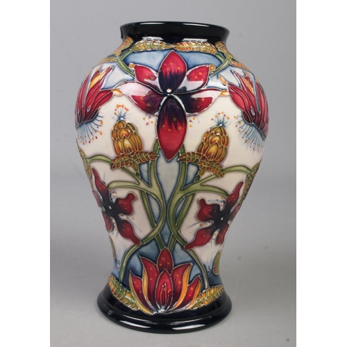 112 - A Moorcroft pottery vase decorated in the Delonix pattern by Shirley Hayes. Date cypher for 2003. He... 