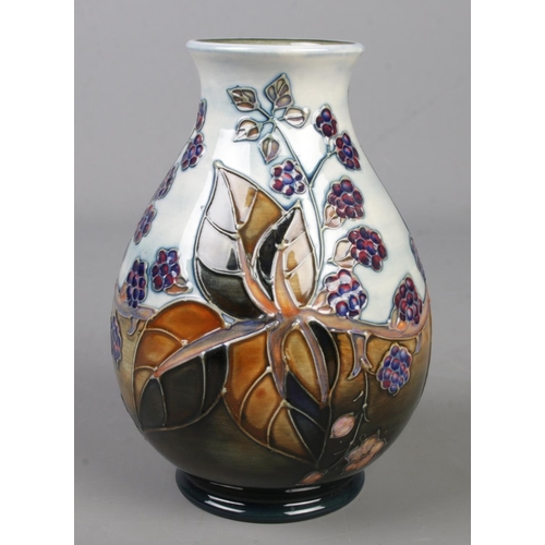 126 - A Moorcroft pottery vase decorated in the Bramble pattern by Sally Tuffin. Date cypher for 1991. Hei... 