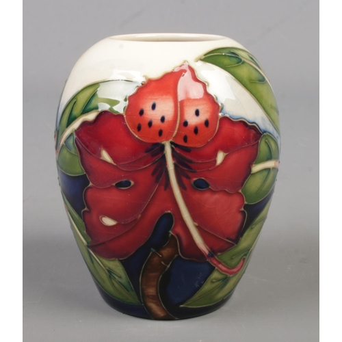 130 - A small Moorcroft pottery vase decorated in the Simeon pattern by Philip Gibson. Date cypher for 200... 