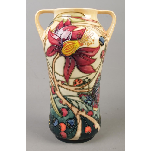 132 - A Moorcroft pottery twin handled vase decorated in the Hartgring pattern by Emma Bossons. Date cyphe... 