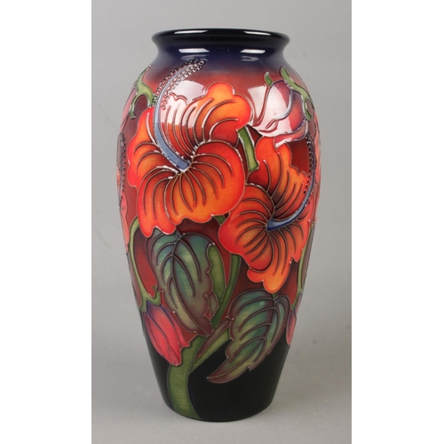 133 - A Moorcroft pottery vase decorated in the Hibiscus Flambe pattern by Kerry Goodwin. Date cypher for ... 