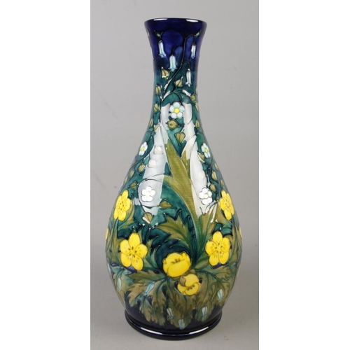 135 - A large Moorcroft pottery vase decorated in the Buttercup pattern by Sally Tuffin. Date cypher for 1... 