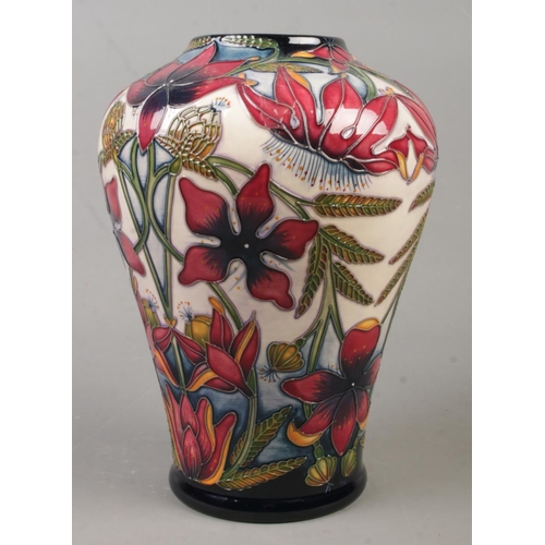 136 - A Moorcroft pottery vase decorated in the Delonix pattern by Shirley Hayes. Date cypher for 2003. He... 