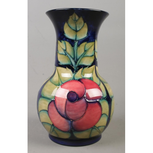 137 - A Moorcroft pottery vase decorated in the Rose pattern by Sally Tuffin. Date cypher for 1990. Height... 