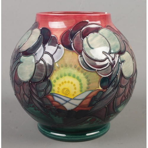 29 - A Moorcroft pottery vase decorated in the Winter Seasons pattern. Date cypher for 1992. Height 17cm.