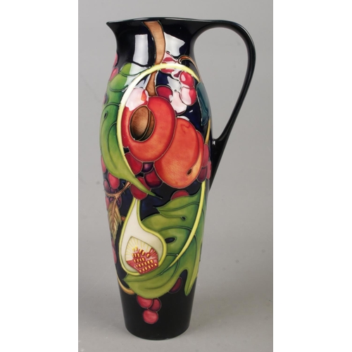38 - A Moorcroft pottery jug decorated in the Queen's Choice pattern by Emma Bossons. Date cypher for 200... 