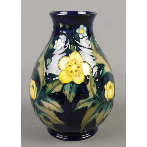 52 - A Moorcroft pottery vase decorated in the Buttercup pattern by Sally Tuffin. Date cypher for 1991. H... 