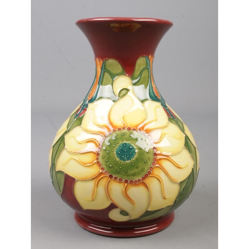 65 - A Moorcroft pottery vase decorated in the Inca Sunflower pattern by Rachel Bishop. Date cypher for 1... 