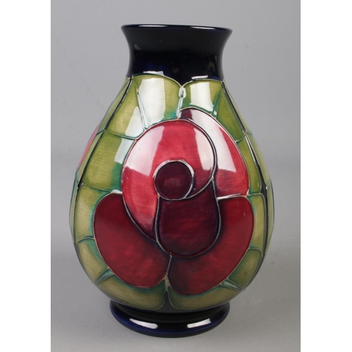 69 - A Moorcroft pottery vase decorated in the Rose pattern by Sally Tuffin. Date cypher for 1991. Height... 