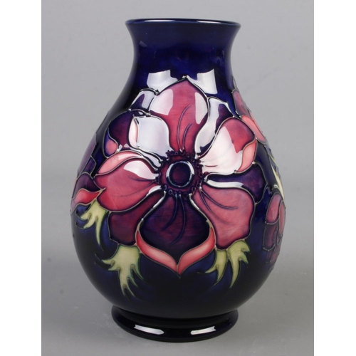 74 - A Moorcroft pottery vase decorated in the Anemone pattern. Date cypher for 1995. Height 19cm.