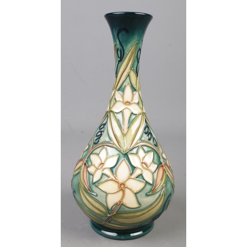 76 - A Moorcroft pottery vase decorated in the Carousel Jasmine pattern. Date cypher for 1997. Numbered 6... 