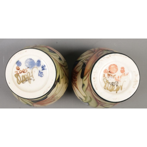 99 - A pair of small Moorcroft pottery vases decorated in the Ode To May pattern by Sian Leeper. Date cyp... 