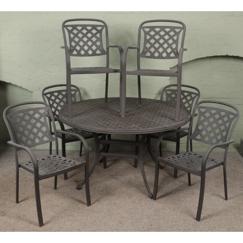 568 - A metal garden table and six chairs.