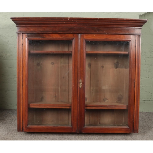 586 - A Victorian mahogany bookcase top. (104cm x 120cm)