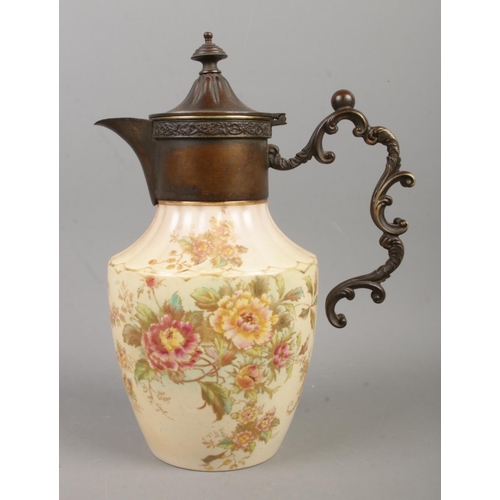 109 - A W&R Carlton Ware ewer, with decorative handle, hinged top in the Peony design. Height: 25cm.