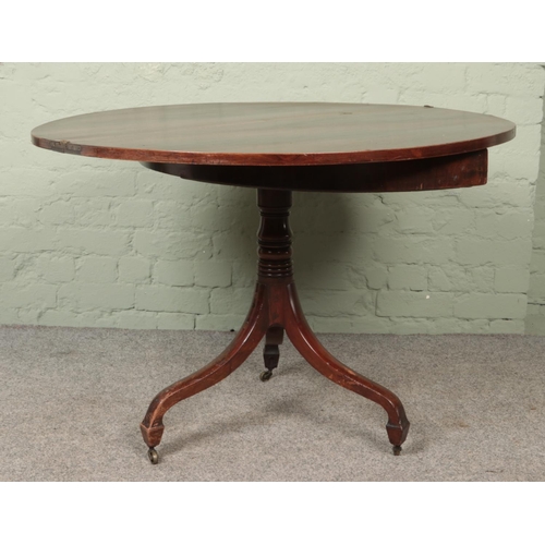 593 - A mahogany fold over card table of demi-lune form on turned pedestal base.

Hx73cm
Wx99cm
Dx50cm